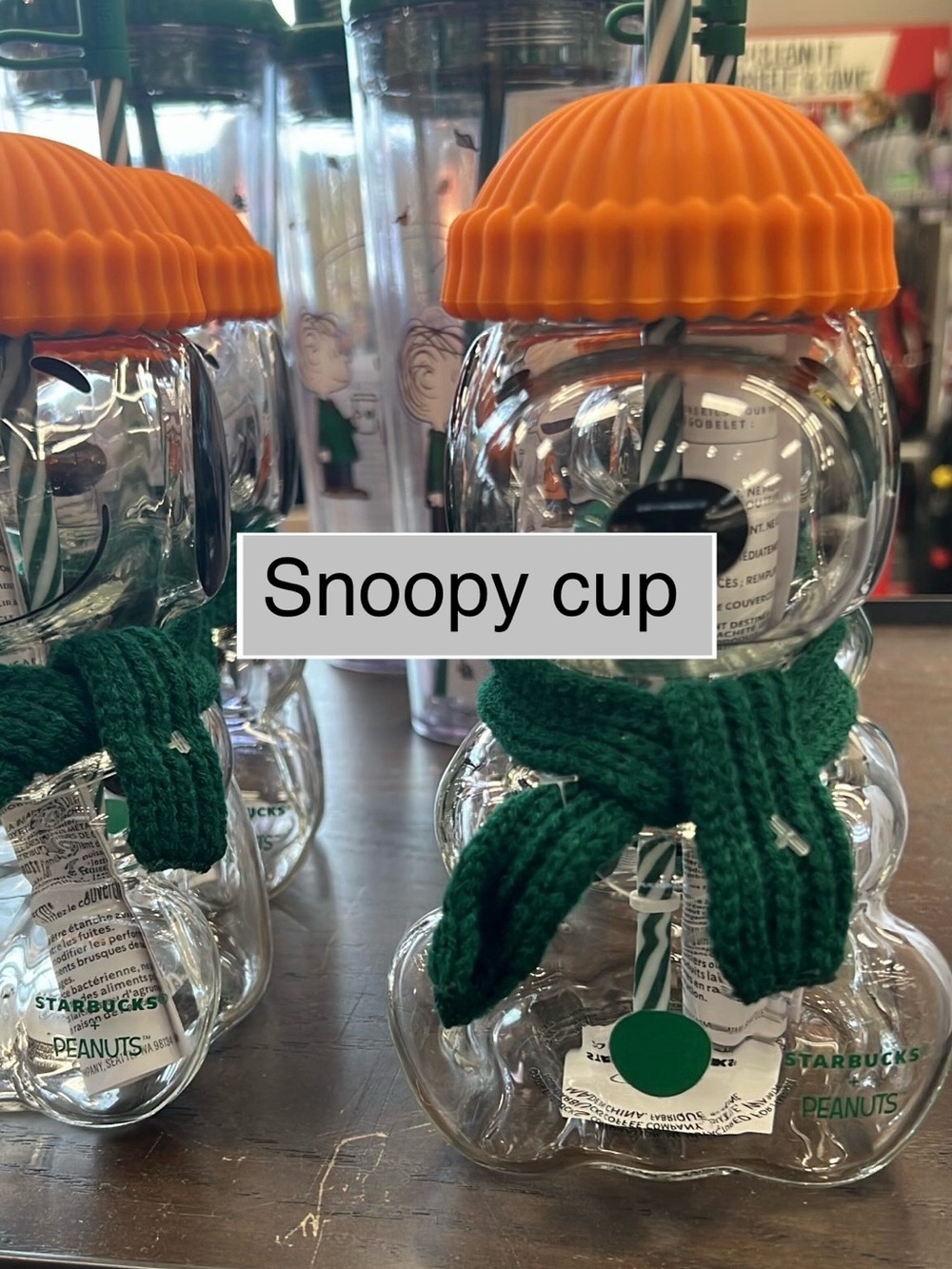 Starbucks Clear Snoopy Glass Cup with Orange Lid and Green Scarf and topper